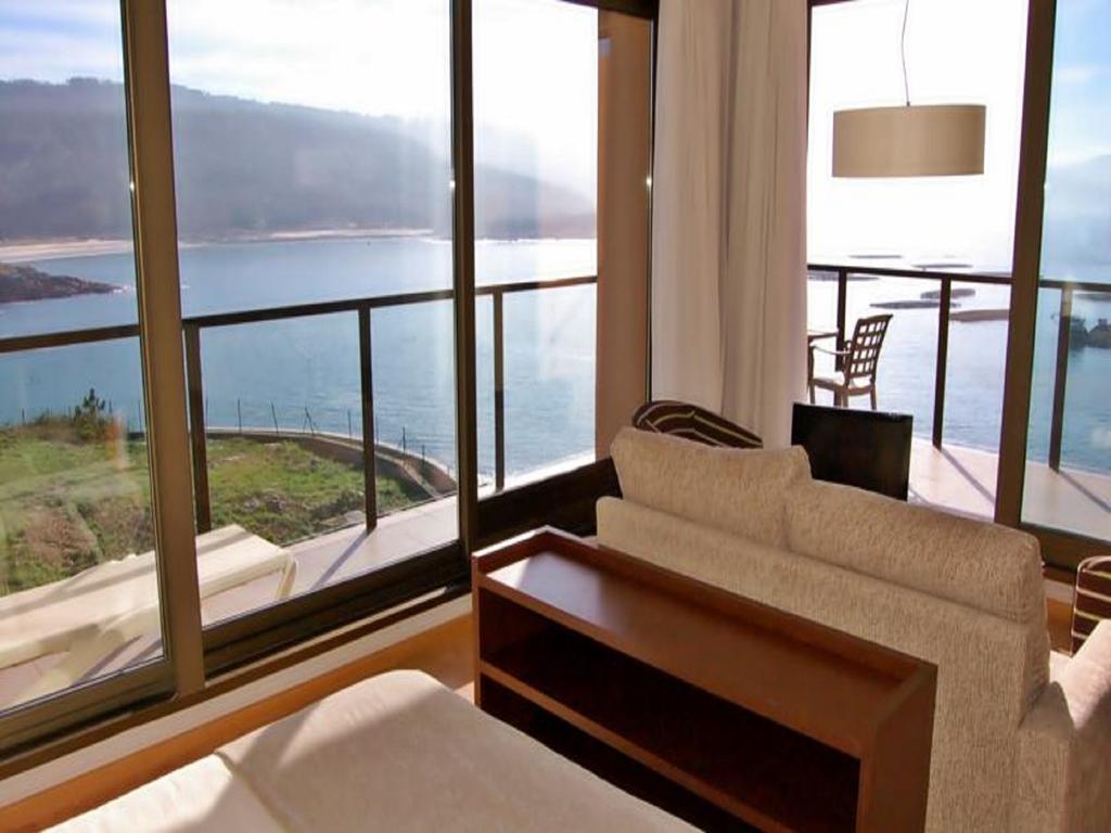 Apartamentos Turisticos Playa De Osmo Corme Екстериор снимка